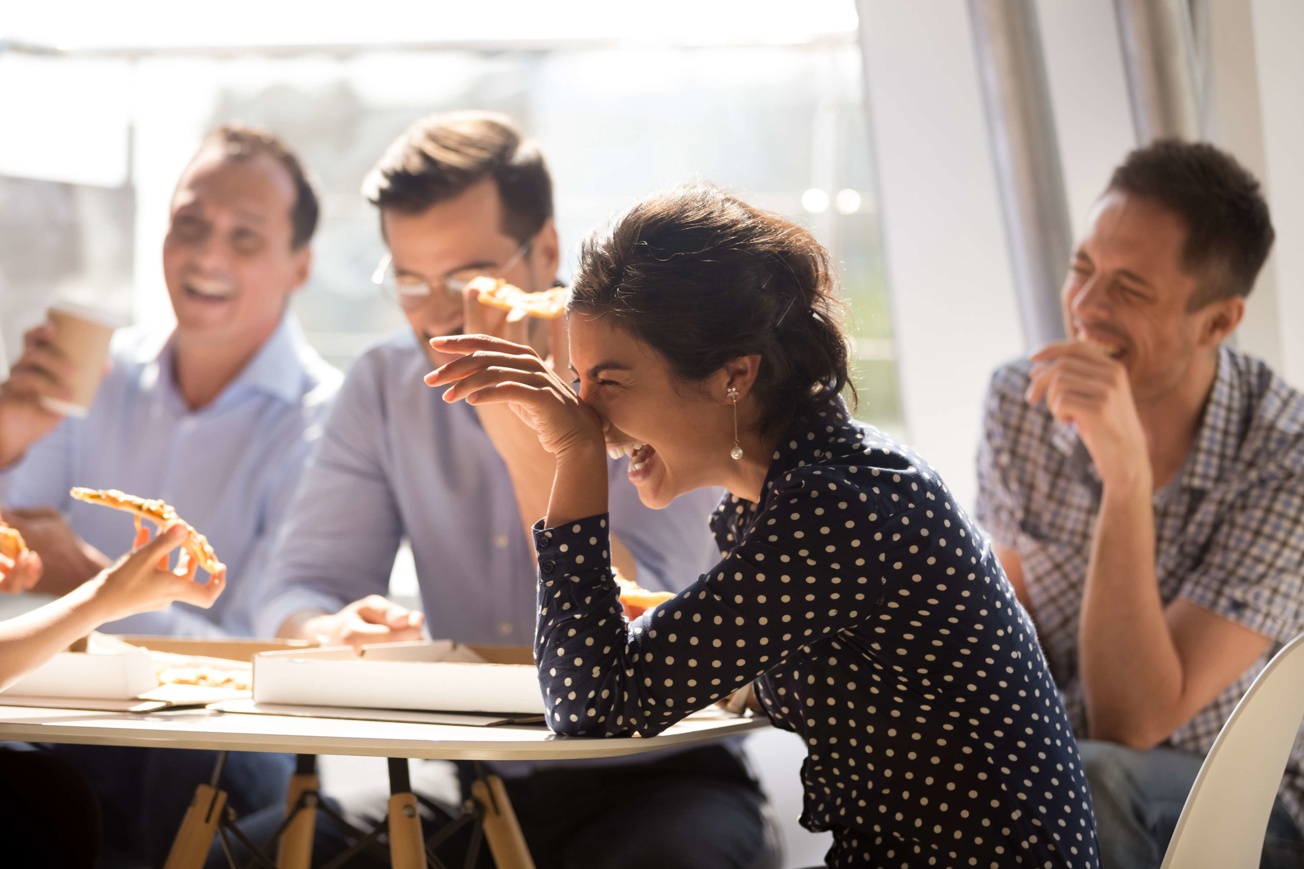 Woman laughing at Daon team lunch